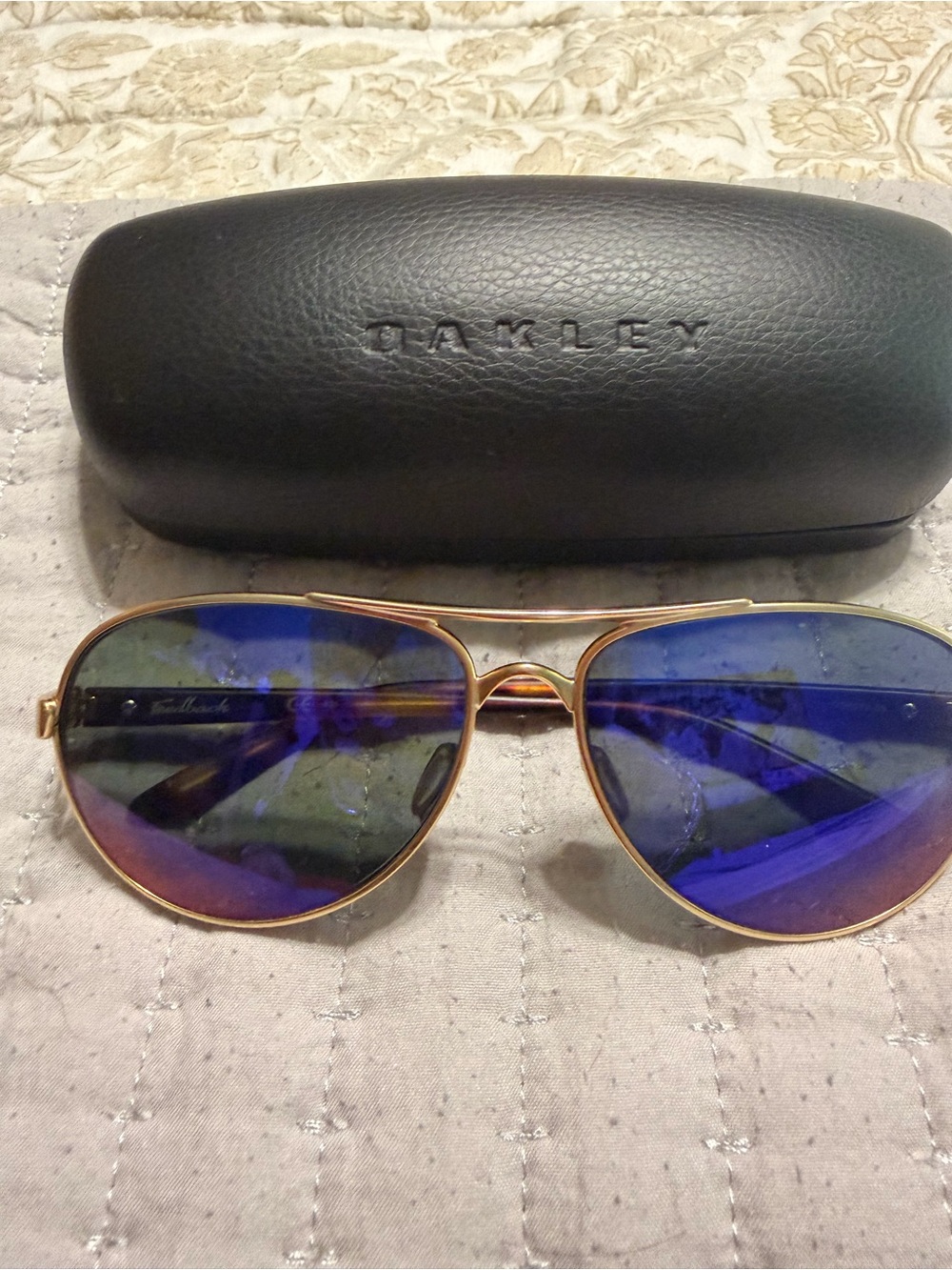 Oakley Women’s Aviator Sunglasses with Blue Mirror Lenses and Gold Frame